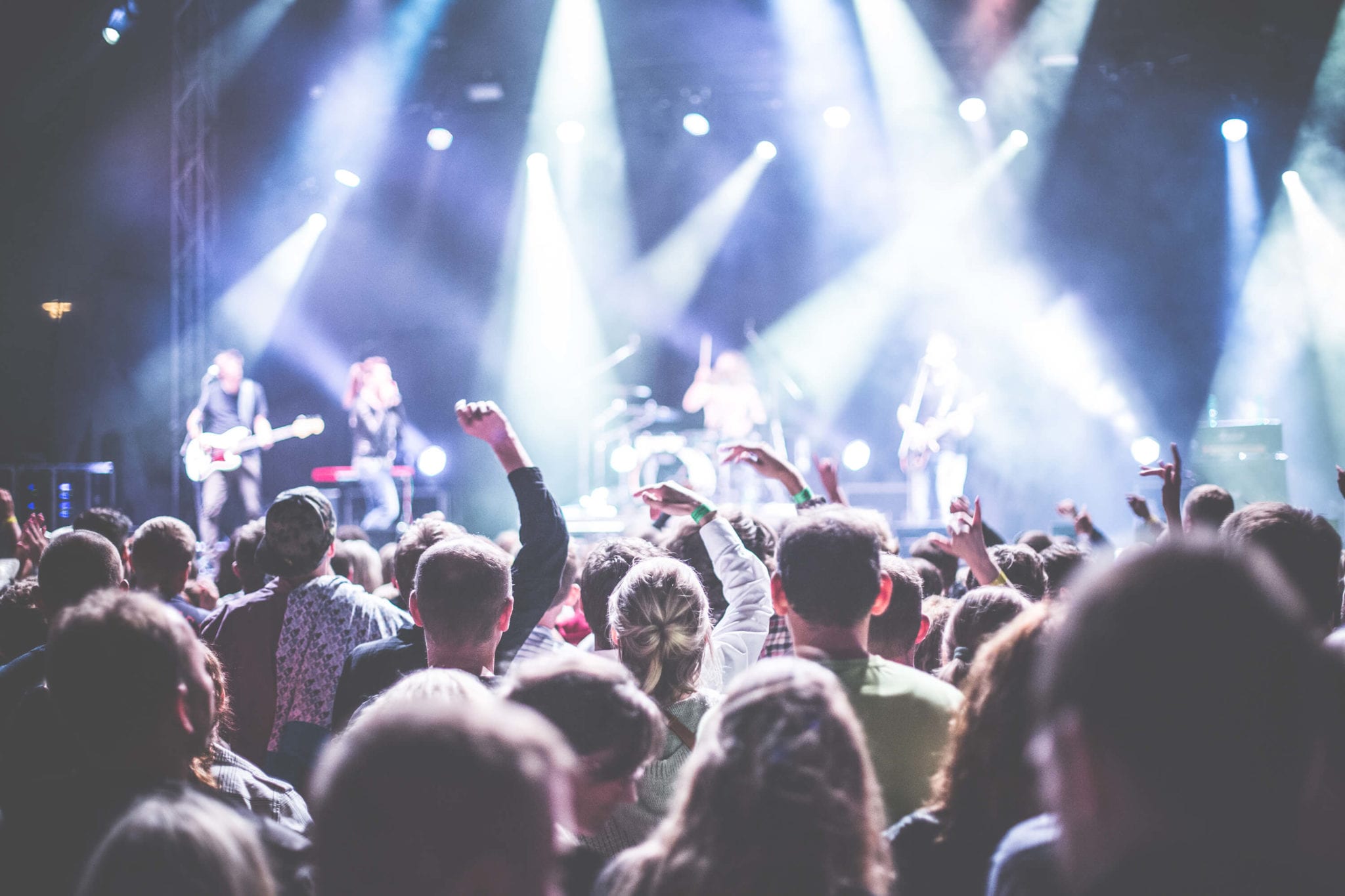 audience cheering at a concert